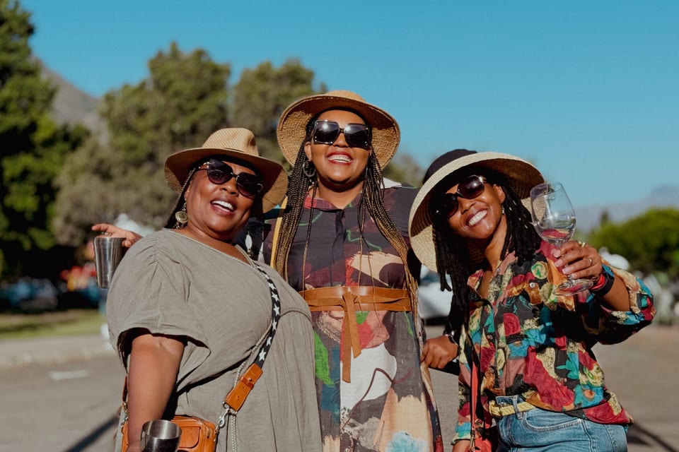 Three friends in sun hats on a summer day in Clarens